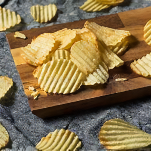 A wooden board with potato chips on it.